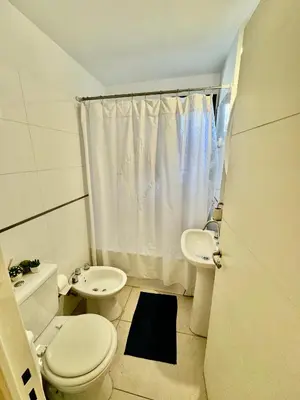 a small bathroom with a toilet and a sink at Buena vista in Cordoba