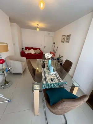 a living room with a glass table and chairs at Buena vista in Cordoba