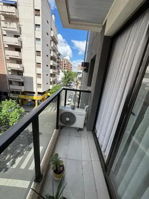 a balcony with a washing machine in a building at Buena vista in Cordoba