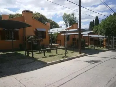 an empty street in front of a building at Los Zarzos in Mina Clavero