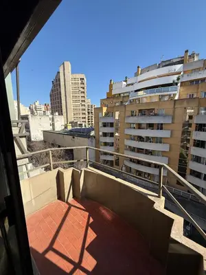 a balcony with a view of a city with buildings at ituzaingo house in Cordoba
