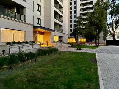 a park in front of a large building at Ópera Park Premium Stay in Cordoba