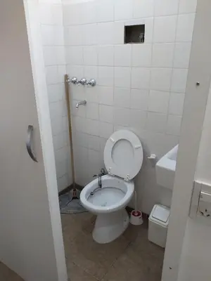 a small bathroom with a toilet and a sink at Departamento Loma Hermosa in Santa Rosa de Calamuchita