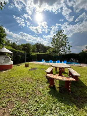a picnic table in a park with a playground at Casas y Chalets Privados Valle del Reposo in Bialet Massé