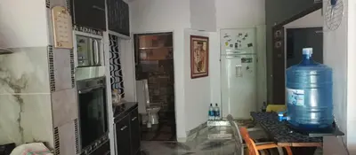 a kitchen with a large water bottle on a table at Casas y Chalets Privados Valle del Reposo in Bialet Massé