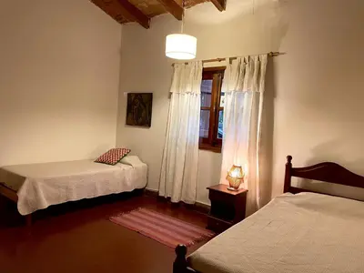 a bedroom with two beds and a window at Casa de campo La Añurita in San Javier