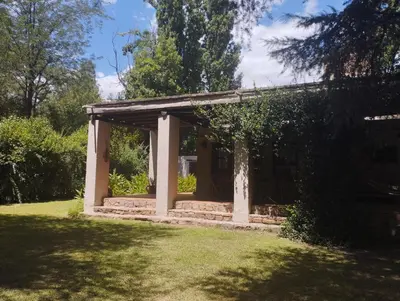 a small pavilion in a garden with a tree at Casa de campo La Añurita in San Javier