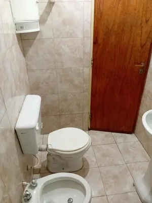 a bathroom with a toilet and a sink at Monoambiente Alto Verde in Cordoba