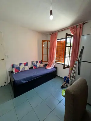 a small room with a bed and a window at Depto Quality in Cordoba