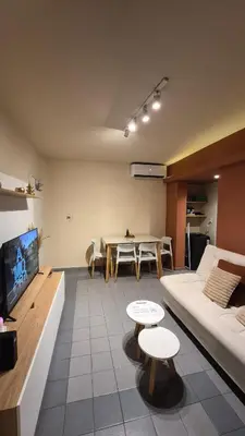 a living room with a couch and a table at Depto Centro con Patio Pet Friendly La Cañada in Cordoba