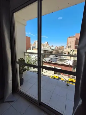 a window with a view of a city at Central y confortable departamento in Cordoba