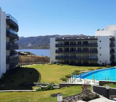 a view of a building and a swimming pool at Veneto Village in Villa Parque Siquiman