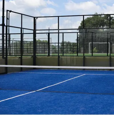 a tennis court with a net on a court at Veneto Village in Villa Parque Siquiman