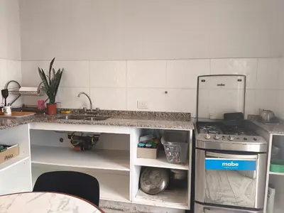 a kitchen with a stove and a sink at refugio Bv los andes in Cordoba