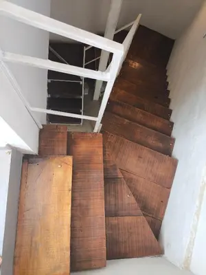 an overhead view of a wooden staircase in a building at refugio Bv los andes in Cordoba