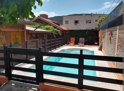 a swimming pool with a fence around it at La tranquera Carlos Paz in Villa Carlos Paz