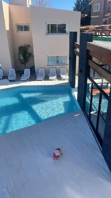 a hat is sitting next to a swimming pool at Por Amor a Norma in Potrero de Garay
