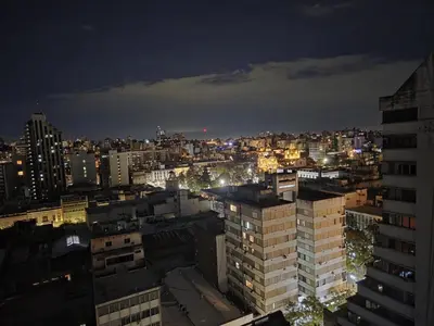 a view of a city at night at Monoambiente cómodo zona centro in Cordoba