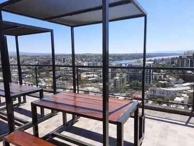 a balcony with benches and a view of the city at Miralejos 7 in Villa Carlos Paz