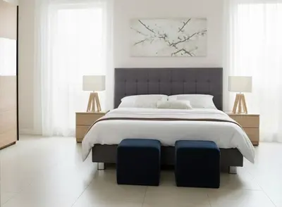 a white bedroom with a large bed with two lamps at Depto cómodo en Nueva Córdoba in Cordoba
