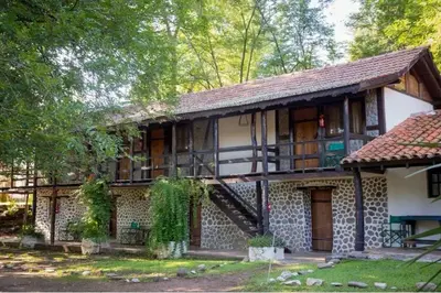 an old house with a staircase in front of it at Estancia san Miguel in San Miguel de los Rios