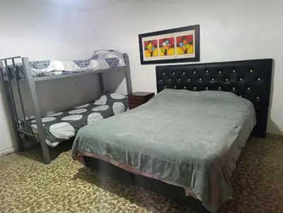 a bedroom with a bed and a bunk bed at Departamento sol in Cordoba