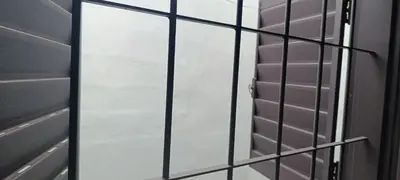 a glass door with a mirror in a bathroom at Departamento sol in Cordoba