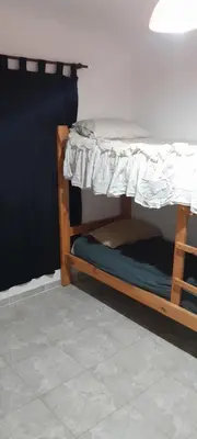 a couple of bunk beds in a room at hogar entre montañas in Santa María