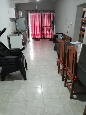 a kitchen with a table and chairs in a room at hogar entre montañas in Santa María