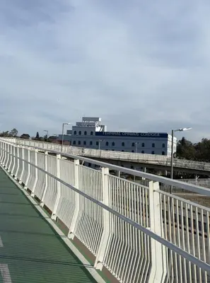 a white bridge with a building in the background at Gral paz Dpto completo con cama queen y seguridad in Cordoba