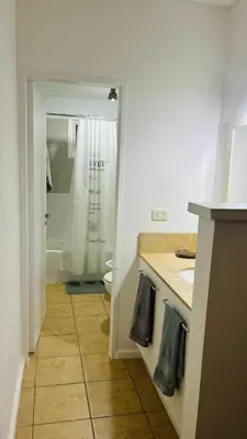 a bathroom with a sink and a toilet and a shower at Excelente Departamento Nueva Córdoba in Cordoba