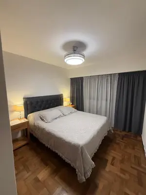 a bedroom with a bed and a window with curtains at Nueva Córdoba Independencia apart in Cordoba