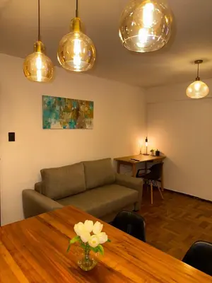 a living room with a couch and a table at Nueva Córdoba Independencia apart in Cordoba