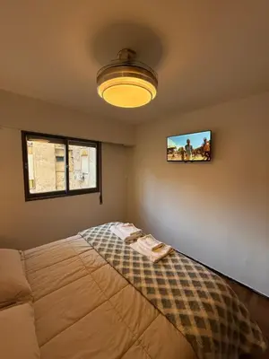 a bedroom with a bed with towels on it at Nueva Córdoba Independencia apart in Cordoba