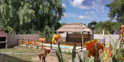 a gazebo and benches in a park at Mi casa en tanti casa 26 in Tanti