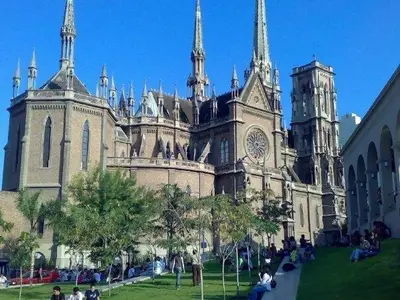 a large cathedral with people sitting in front of it at Spectacular location close to Buen Pastor in Cordoba