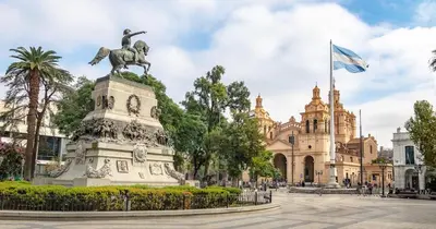 a statue in front of a building with a flag at Spectacular location close to Buen Pastor in Cordoba