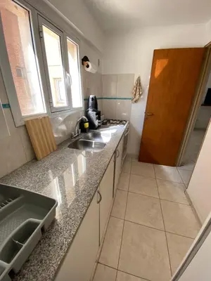 a kitchen with a sink and a counter top at EfeCalm Entre Ríos in Cordoba