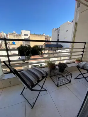 a chair sitting on top of a balcony at EfeCalm Entre Ríos in Cordoba