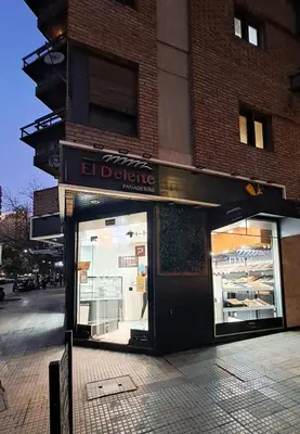 a store front with its doors open on a city street at Cordoba Vibe in Cordoba