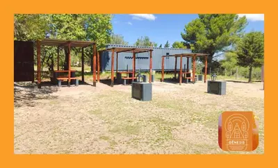 a park with benches and a pavilion in the grass at Complejo Genesis MALLIN in Cueva de los Pajaritos