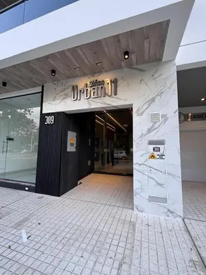 a building with a sign on the front of it at MonoambienteXdia in Villa Dolores