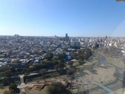 an aerial view of a city with buildings and a river at Comodo y luminoso in Cordoba