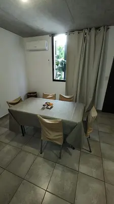 a room with a table and chairs and a window at Calixto C in Cordoba