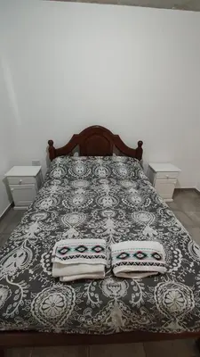 a bedroom with a bed with two pillows on it at Calixto C in Cordoba