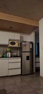 a kitchen with a stove and a microwave at Calixto C in Cordoba