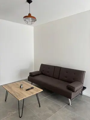 a living room with a couch and a coffee table at Cuidad Gama Luxury - 2 Dormitorios in Cordoba
