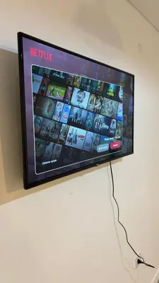 a flat screen tv hanging on a wall at Cuidad Gama Luxury - 2 Dormitorios in Cordoba