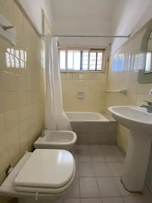 a bathroom with a toilet and a sink and a tub at Casa con Piscina y Vista al Lago in Villa Santa Cruz del Lago