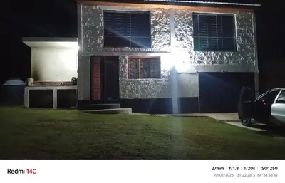 a house with a light on the side of it at night at Lo de Antó in Cavalango